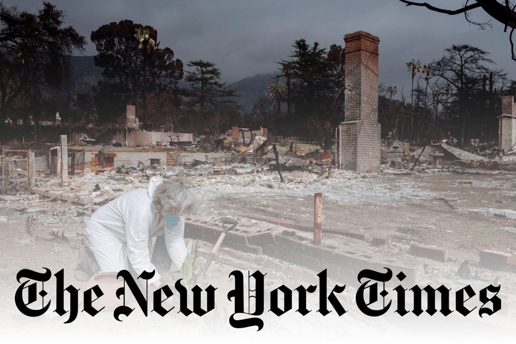 A woman in a white protective suit, mask and gloves kneels and has a plant in her hand. She is surrounded by the remains of a home and a standing chimney.