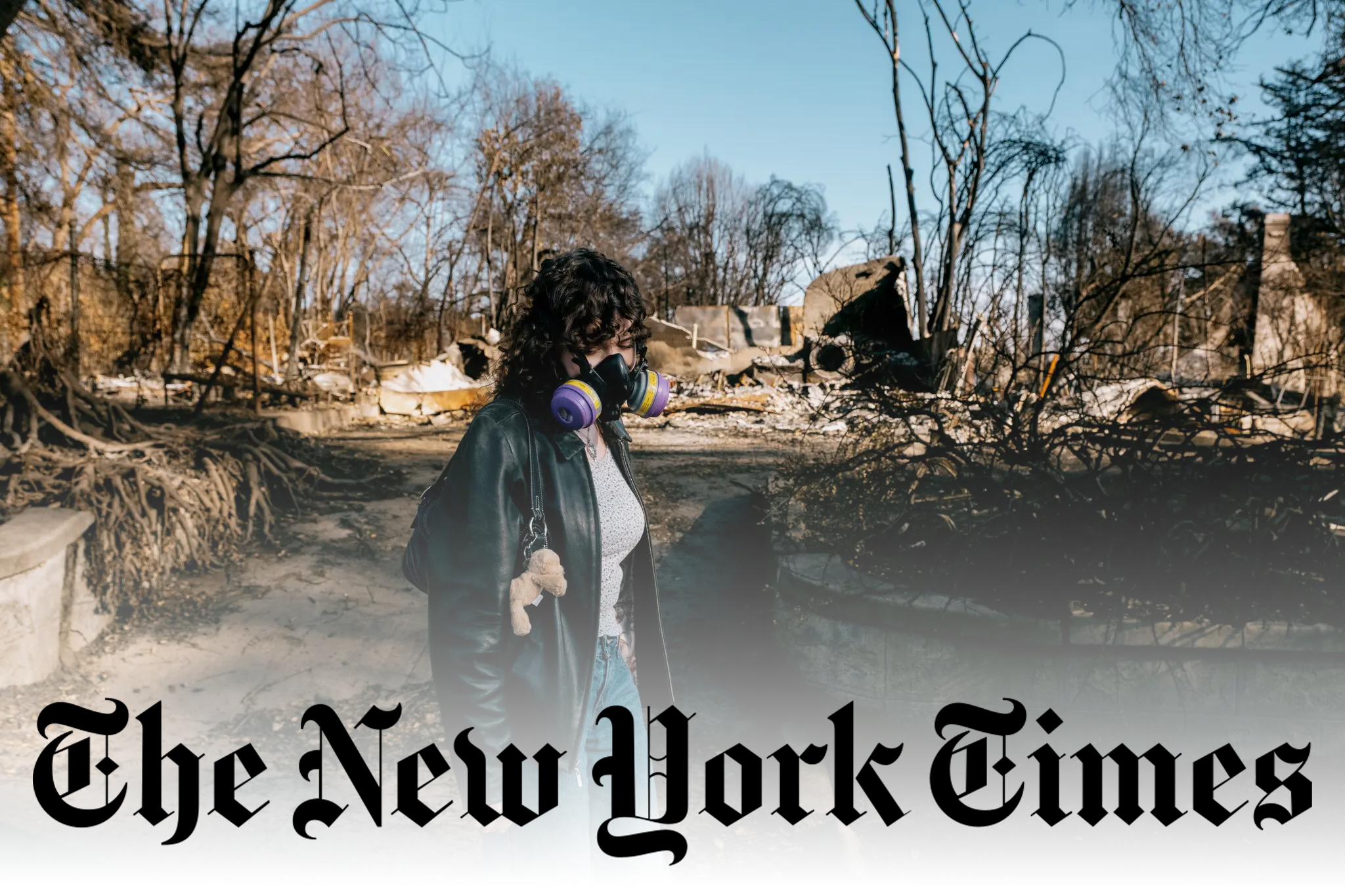 Woman wearing a purple mask standing in the aftermath of the Eaton fire.